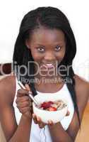 Cheerful woman having breakfast