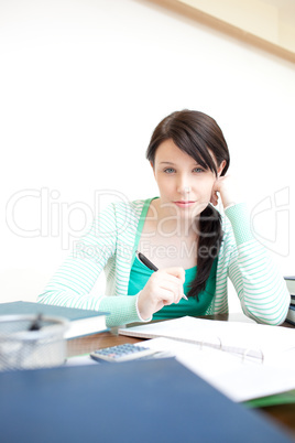 Charming teen girl studying