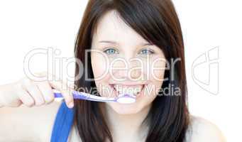 Smiling woman brushing her teeth