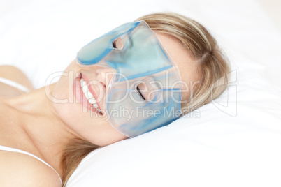 Relaxed woman with an eye gel mask