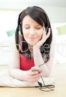 Relaxed woman listening music with headphones on