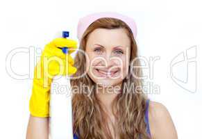 Attractive woman holding a detergent spray
