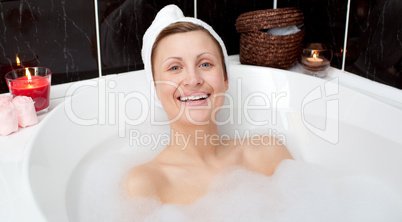 Cheerful attractive woman in a bubble bath