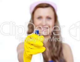 Young woman holding a detergent spray