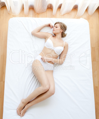 Attractive woman in underwear lying