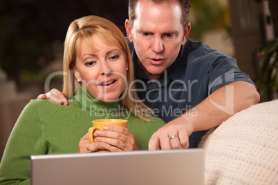 Handsome Couple Using Laptop