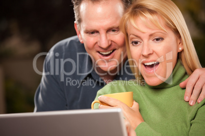 Handsome Couple Using Laptop