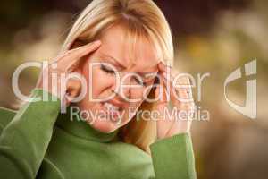 Grimacing Woman Suffering a Headache
