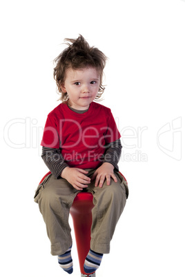 Cute boy sitting on a chair