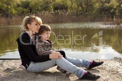 Little child with his mother looking away