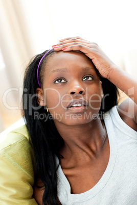 Portrait of an Afro-american woman lying on a sofa