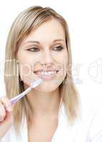 Radiant woman holding a toothbrush