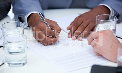 Close-up of ambitious business people closing a deal