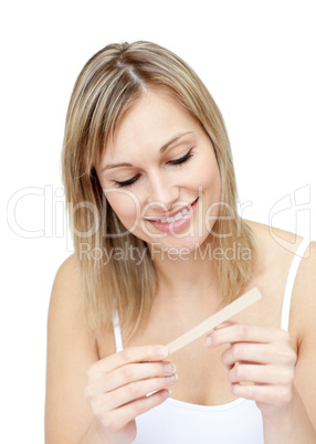 Portrait of an attractive  woman filing her nails