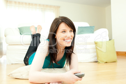 Jolly woman watching television