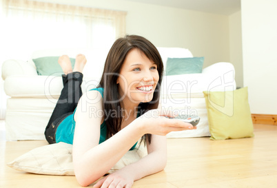 Joyful woman watching television