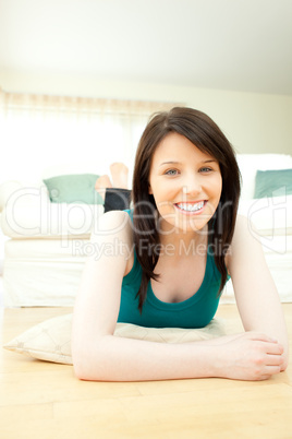 Elegant woman lying down on the floor