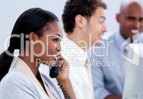 Positive Afro-American businesswoman talking on phone