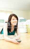 Attractive woman watching television