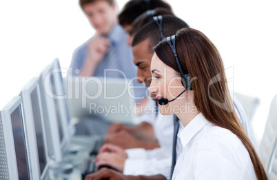 Smiling business team working in a call center