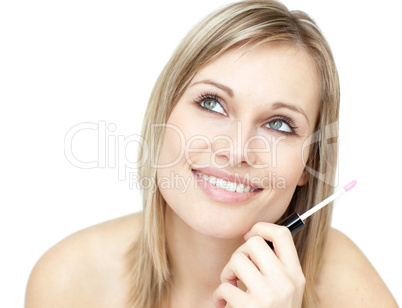 Portrait of a beautiful woman holding a lipstick