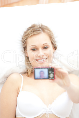 Attractive woman taking a picture of herself