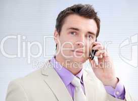 Charming businessman talking on phone