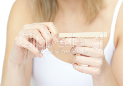 Portrait of a bright woman filing her nails