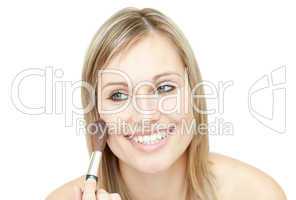 Bright woman using a powder brush