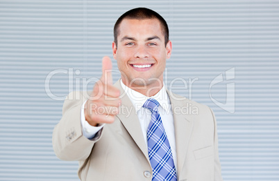 Cheerful businessman with a thumb up