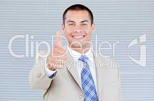 Cheerful businessman with a thumb up