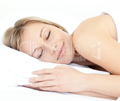 Radiant woman sleeping on her bed