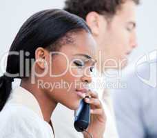 Concentrated Afro-American businesswoman talking on phone