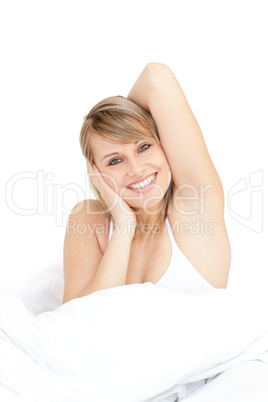 Radiant woman stretching while getting up