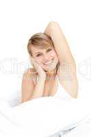 Radiant woman stretching while getting up