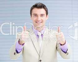 Successful businessman with thumbs up