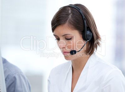 Portrait of a brunette customer agent at work