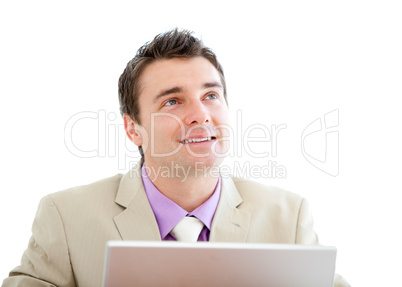 Pensive businessman using a laptop