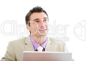 Pensive businessman using a laptop