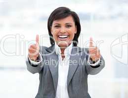 Portrait of a successful business woman with thumbs up