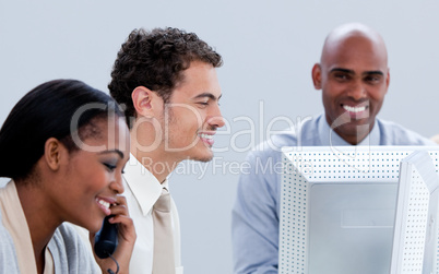 Three business people working in the office