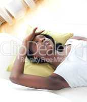 Portrait of a sick woman lying on a sofa