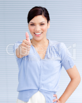 Happy businesswoman with a thumb up