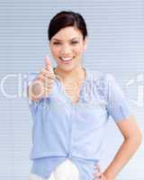 Happy businesswoman with a thumb up
