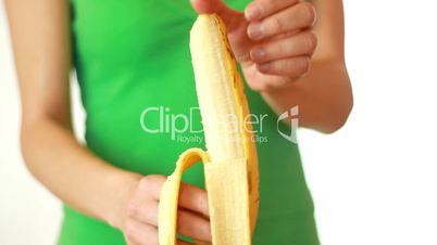 Hands peeling banana