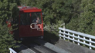 Cable car ascends a steep hill