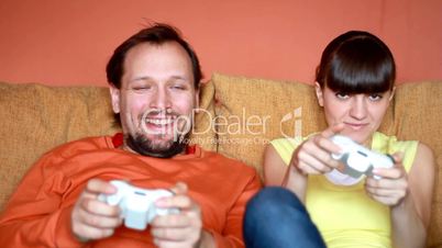 Man and Woman playing videogames