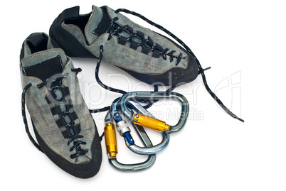 carabiners and climbing shoes