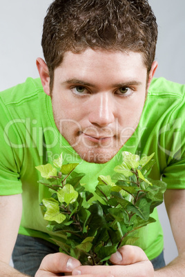 Man holding small plant