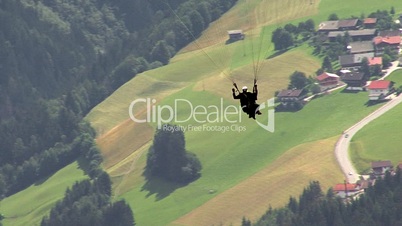 paraglider over austrian villag
